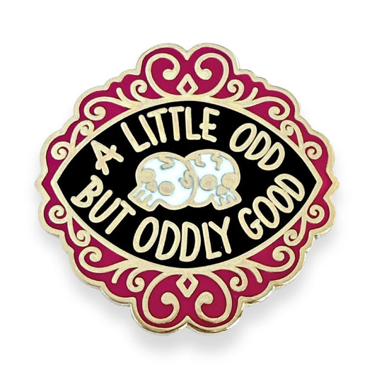Pin with 'A Little Odd But Oddly Good' text and skull design on a white background